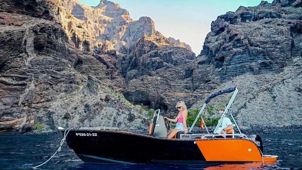 Tenerife: Discover Los Gigantes While Navigating a Boat - The secret stop: photos, aperitif, local snacks, and water time